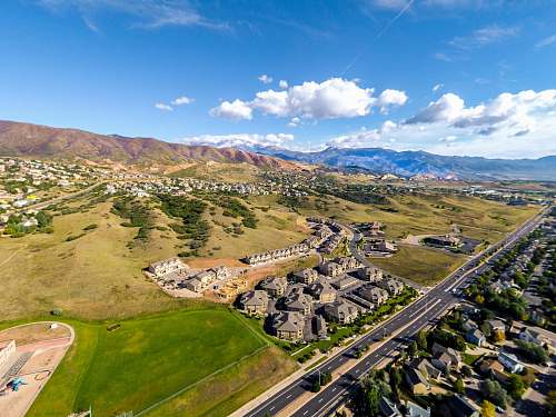 landscape aerial photography of houses near mountain nature